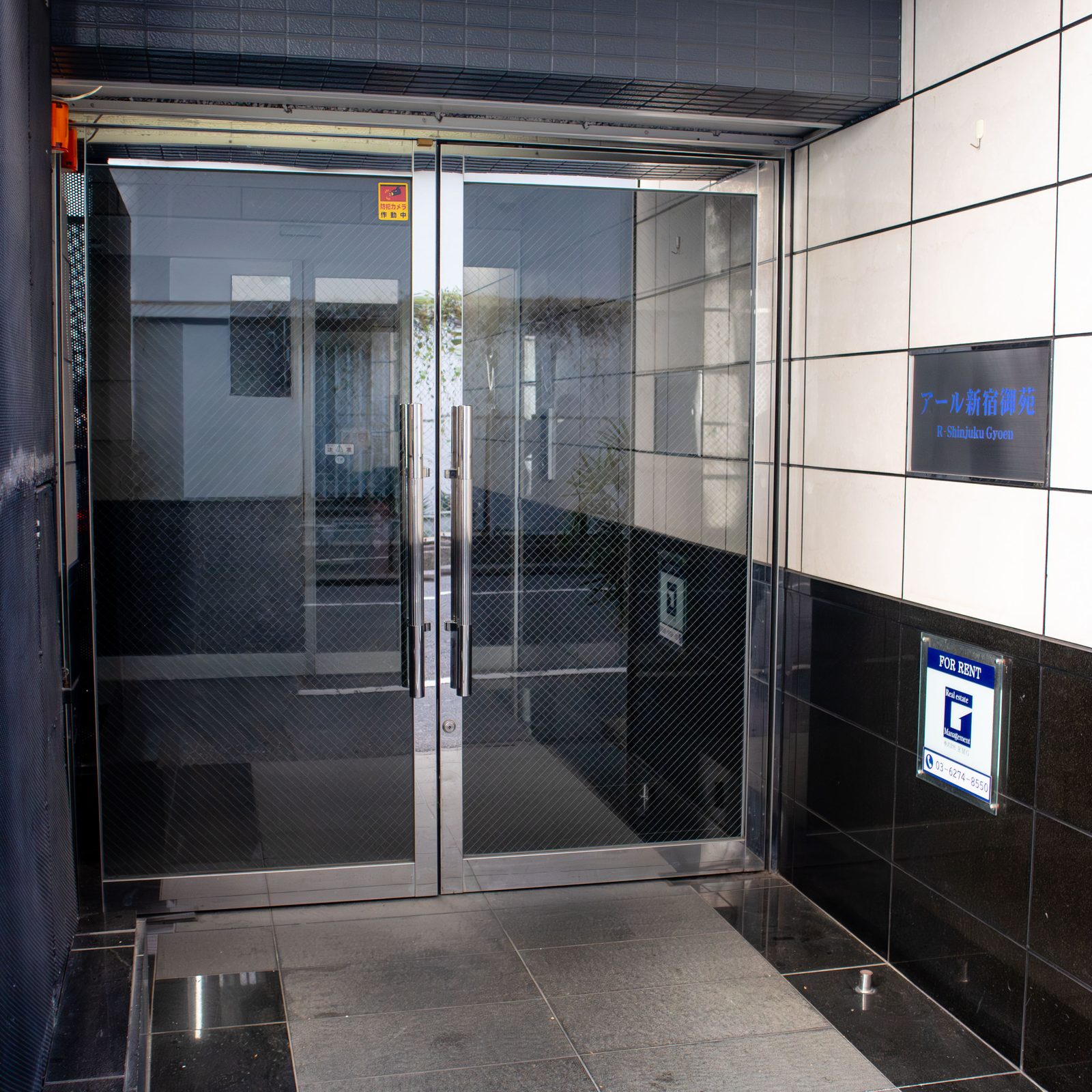 Glass double door entrance of the building.